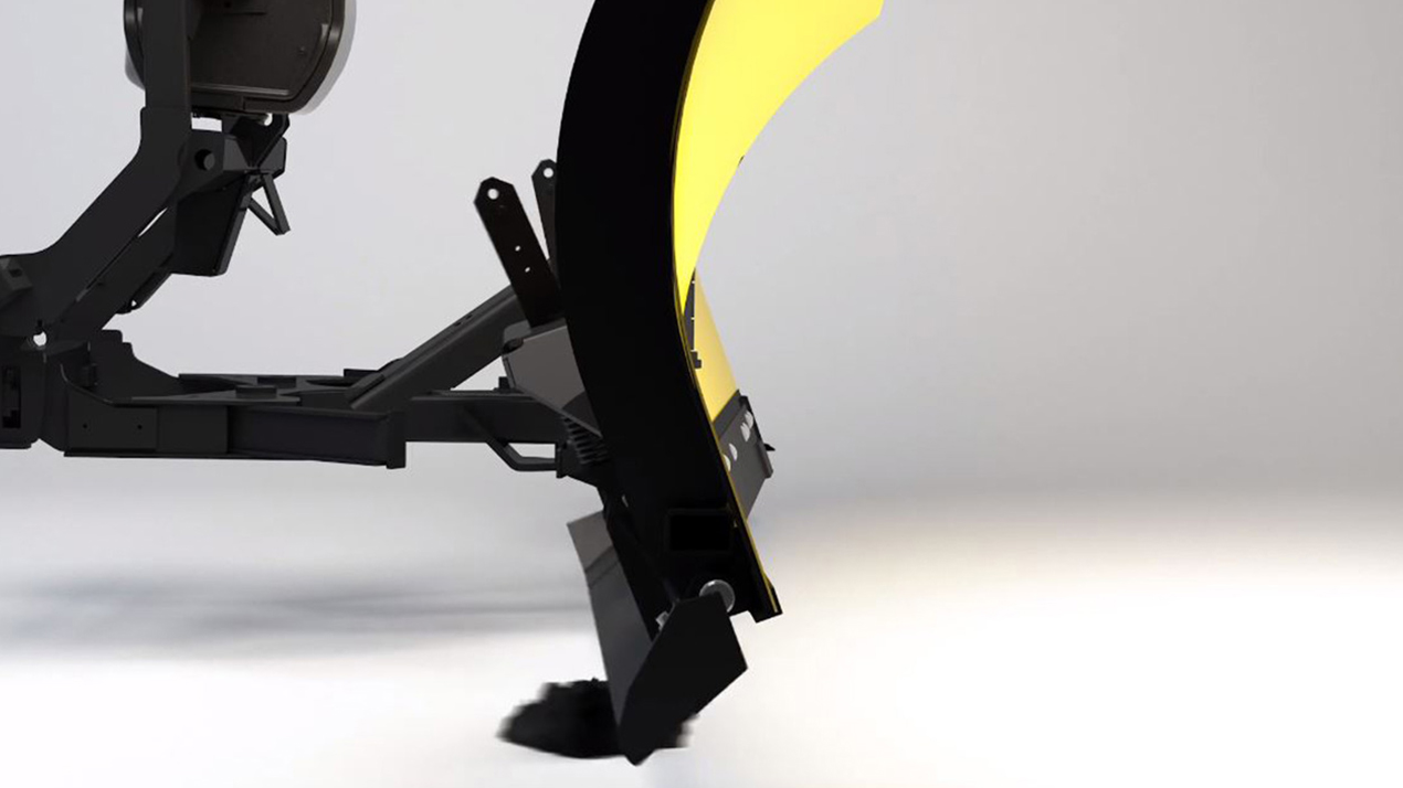 A close-up of a yellow snow plow blade attached to black metal machinery, positioned against a plain, light background with the blade touching the ground.