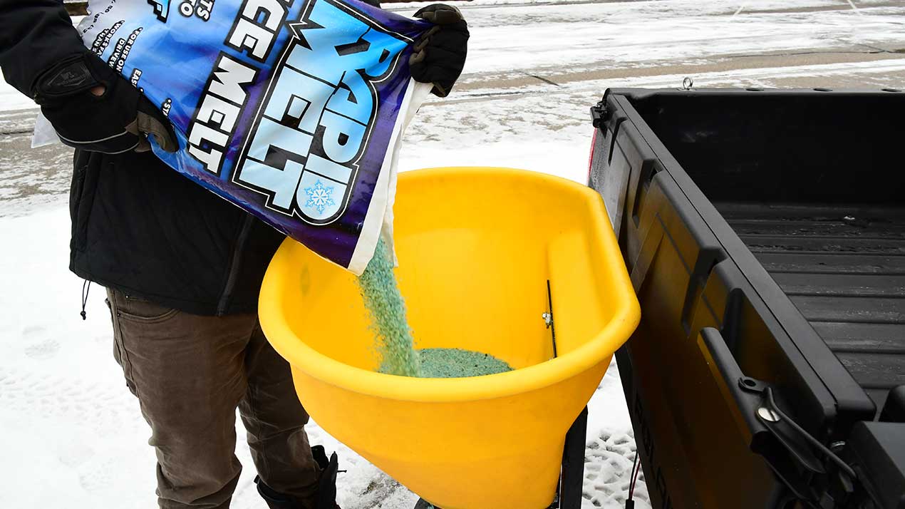 Pouring Salt Into Utility Tailgate