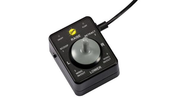 A black electronic joystick controller with a gray handle, labeled with options: raise, lower, left, right, scoop, float, retract, and wing in/out. A cable extends from the top right corner.