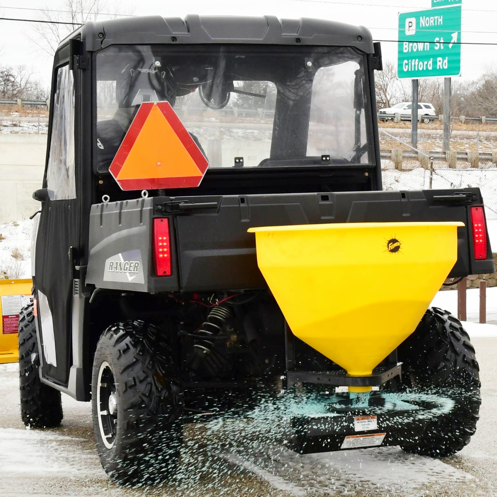 QUICK CASTER 300-300G spreader on back of UTV